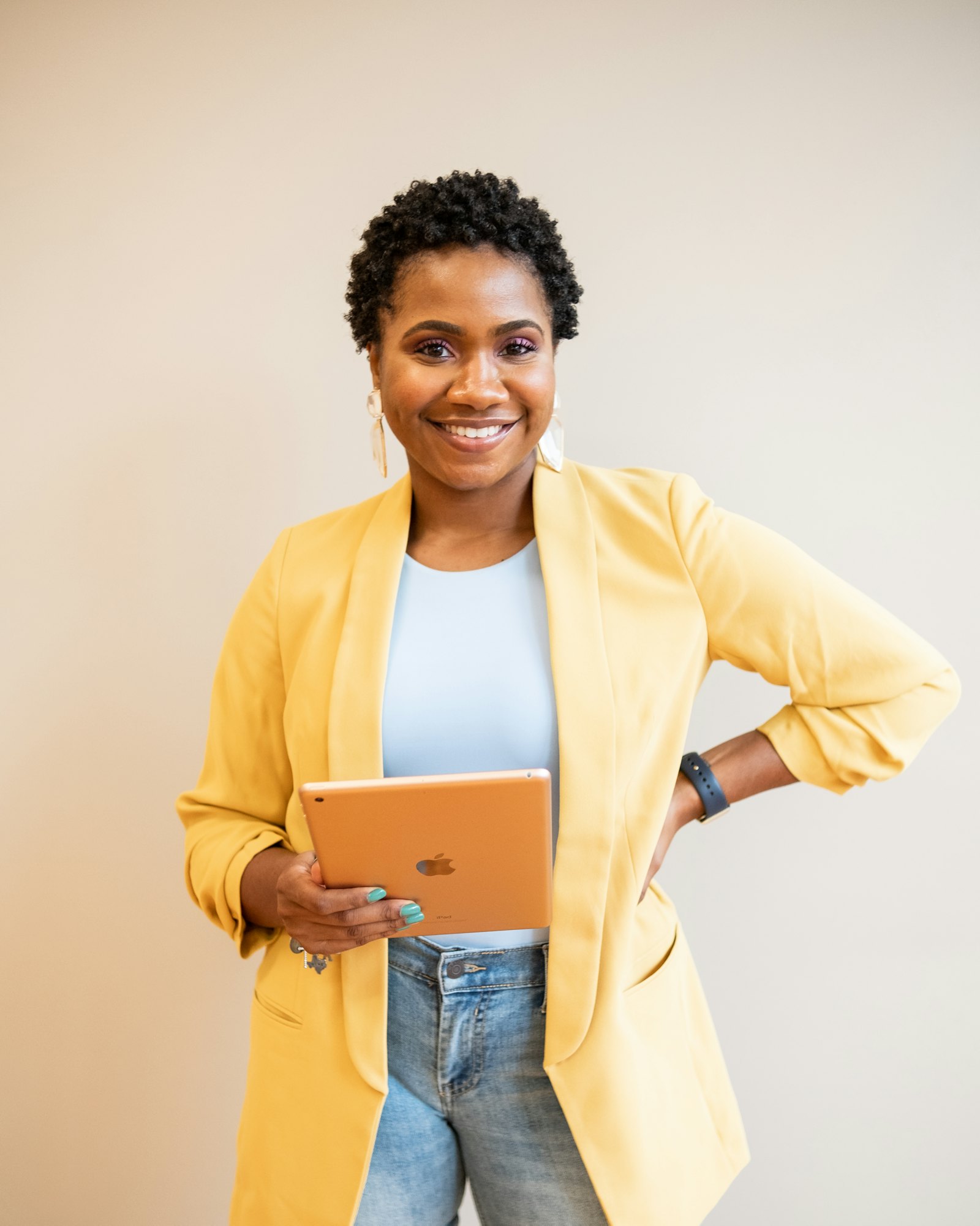 Smiling professional holding a tablet